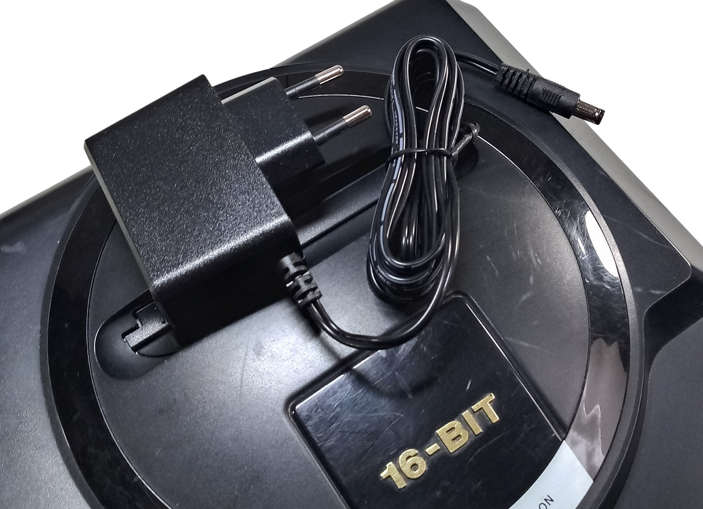 Regulated power supply for Sega Mega Drive / Genesis 1 with EU plug on top of the console