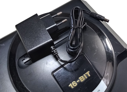 Regulated power supply for Sega Mega Drive / Genesis 1 with EU plug on top of the console