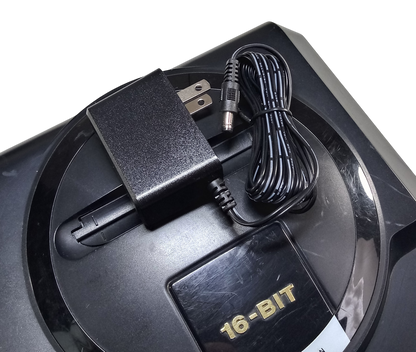 Regulated power supply for Sega Mega Drive / Genesis 1 with US plug on top of the console